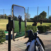 Golfer using the golfstikcam to check golf swing with mobile phone